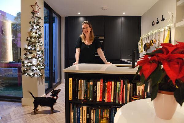 Jennifer Sheahan with Perry: A flat Christmas tree takes up zero floor space. Picture: Moya Nolan